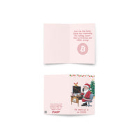 Load image into Gallery viewer, Santa Got Rekt Bitcoin greeting card featuring a humorous illustration of Santa at a desk with Christmas decor, referencing cryptocurrency and DOGE.
